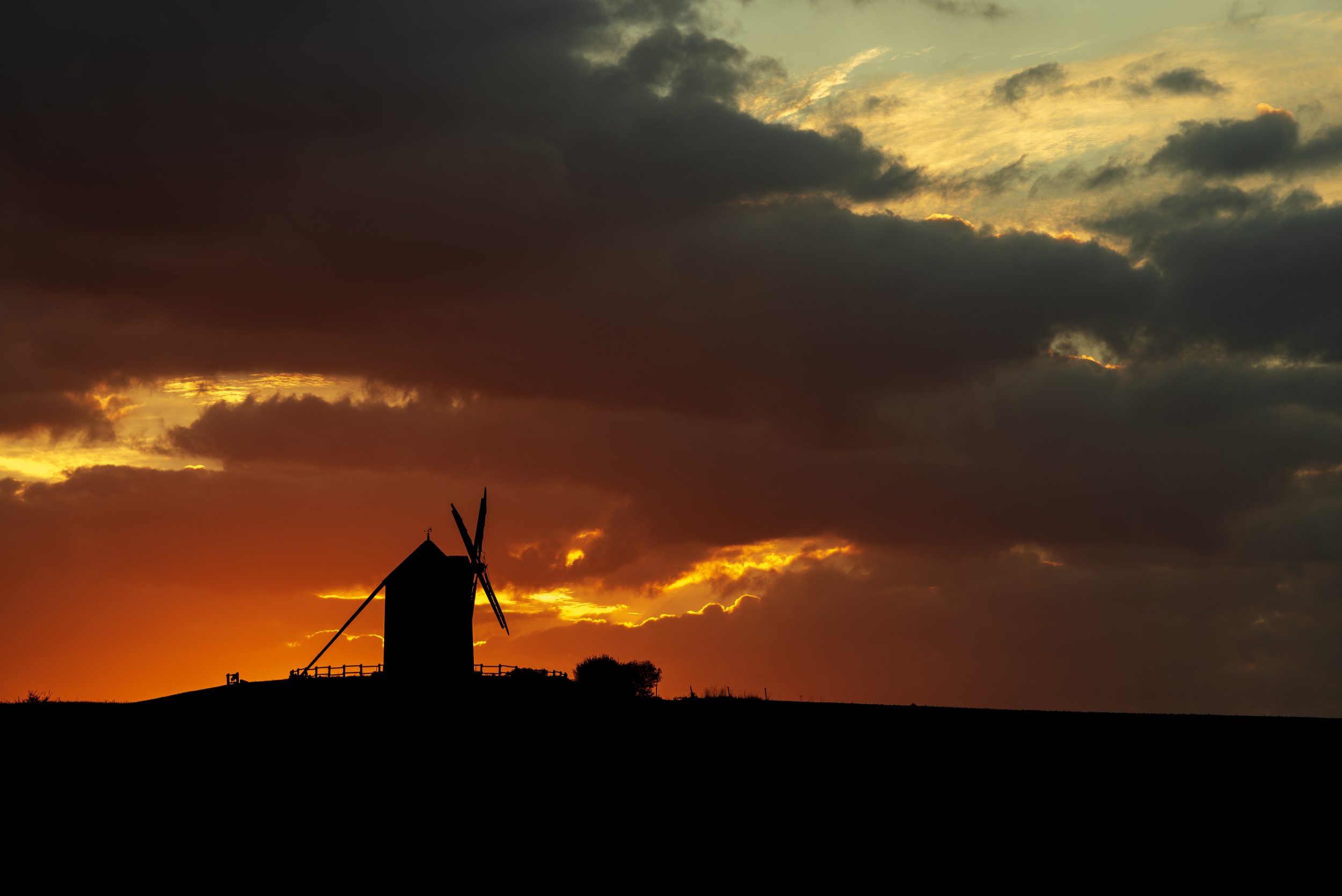 Red sky over Moulin de Moidrey during sunrise