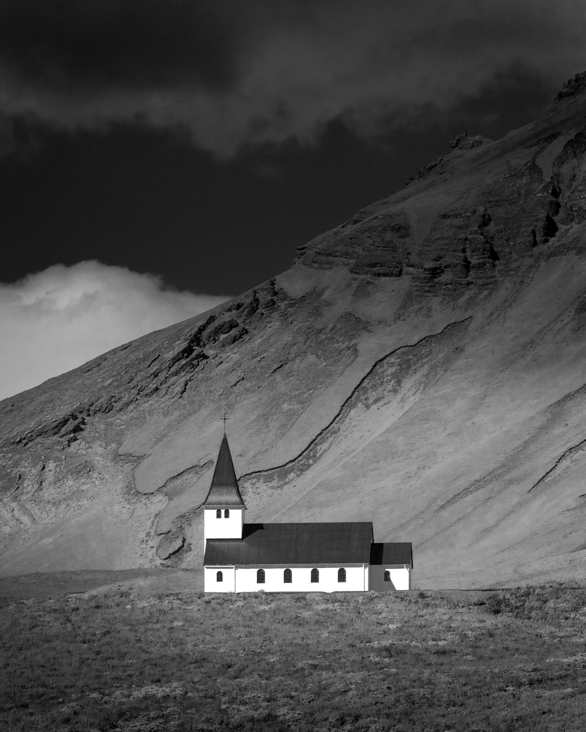 Black and white photo of the Búðakirkja in Vik, Iceland.