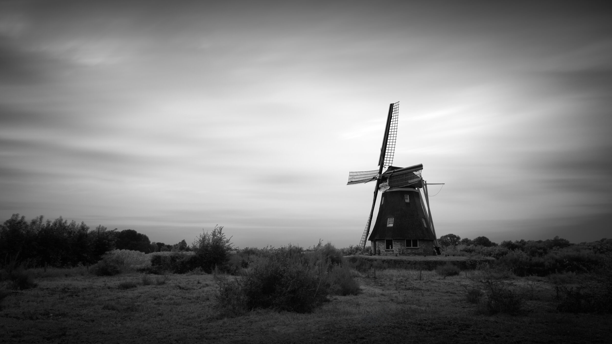 Long exposure black and white photo of a windmill in The Netherlands