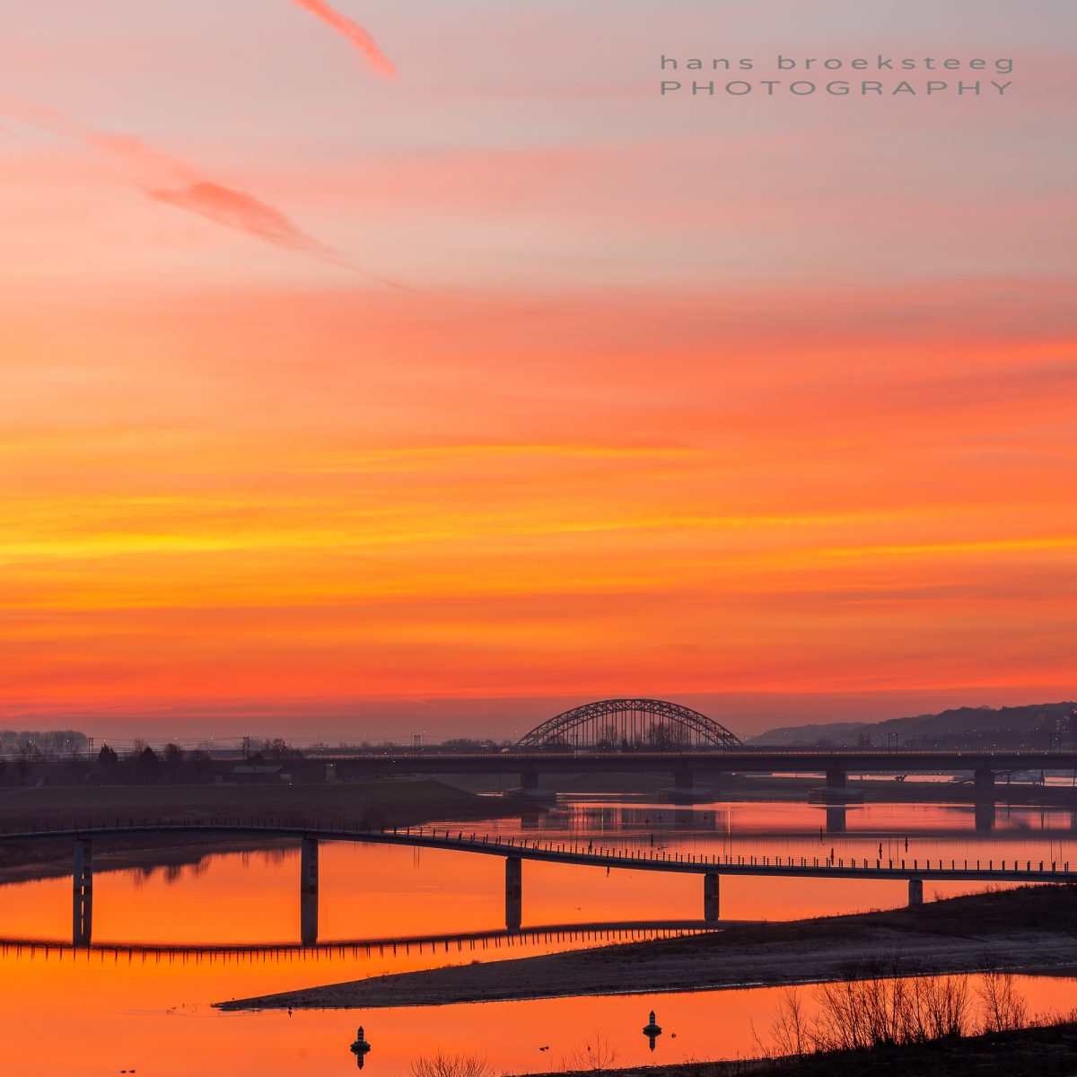 Morning view with amazing red sky over the Waal river, Nijmegen